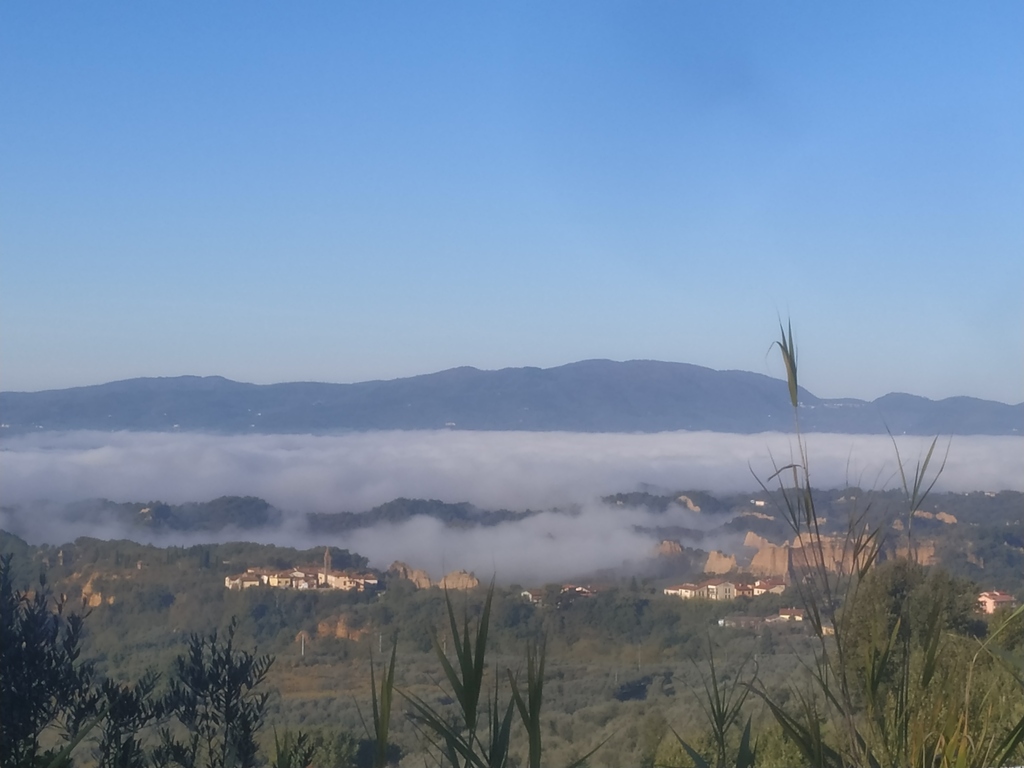 Landscape of the Valdarno, under the fog, with the Balze, visible from the surroundings of Certignano.