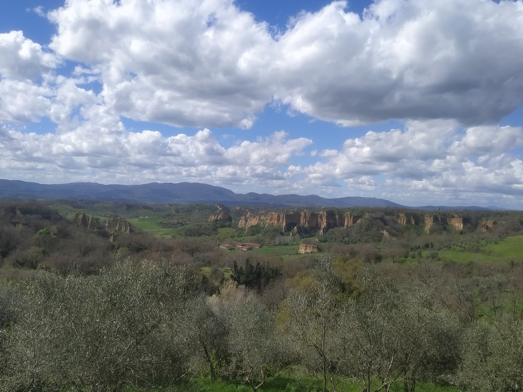 Clouds over the olive groves and the Balze of Valdarno.