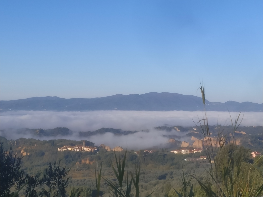 Landscape of the Valdarno, under the fog, with the Balze, visible from the surroundings of Certignano.