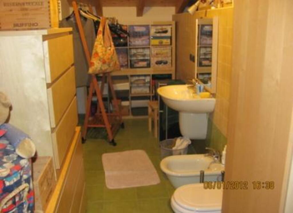 The toilet upstairs, next to the bedroom
