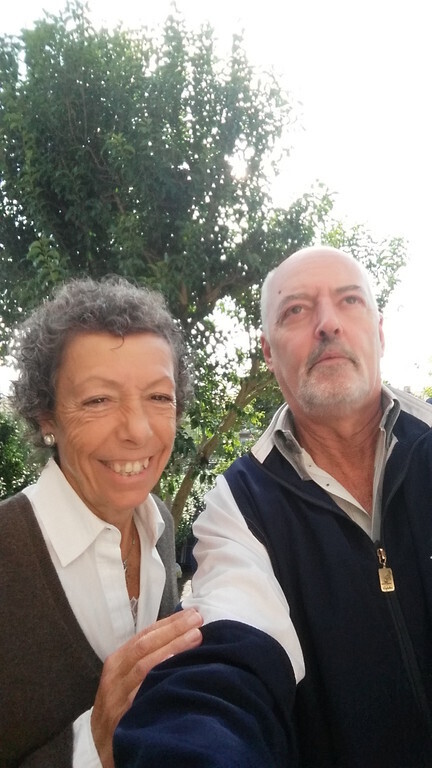 Flavia laughs and Sergio looks up