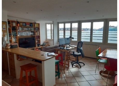 The tv, sofa and dining room side...