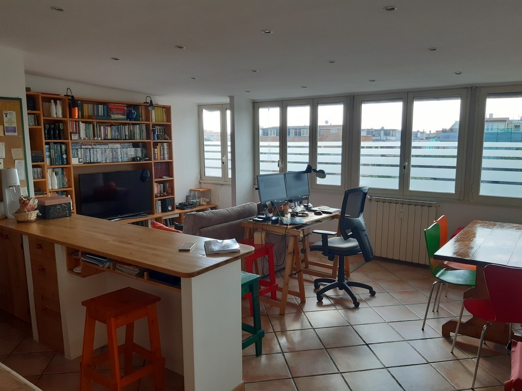 The tv, sofa and dining room side...