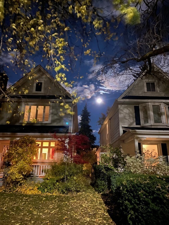Our house (on the left) during a full moon! Front porch perfect for watching the world go by and chatting with neighbours.