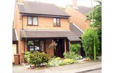 The front of our house with our drive and garage on the right.