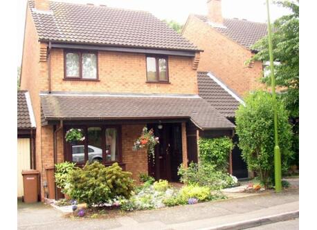 The front of our house with our drive and garage on the right.