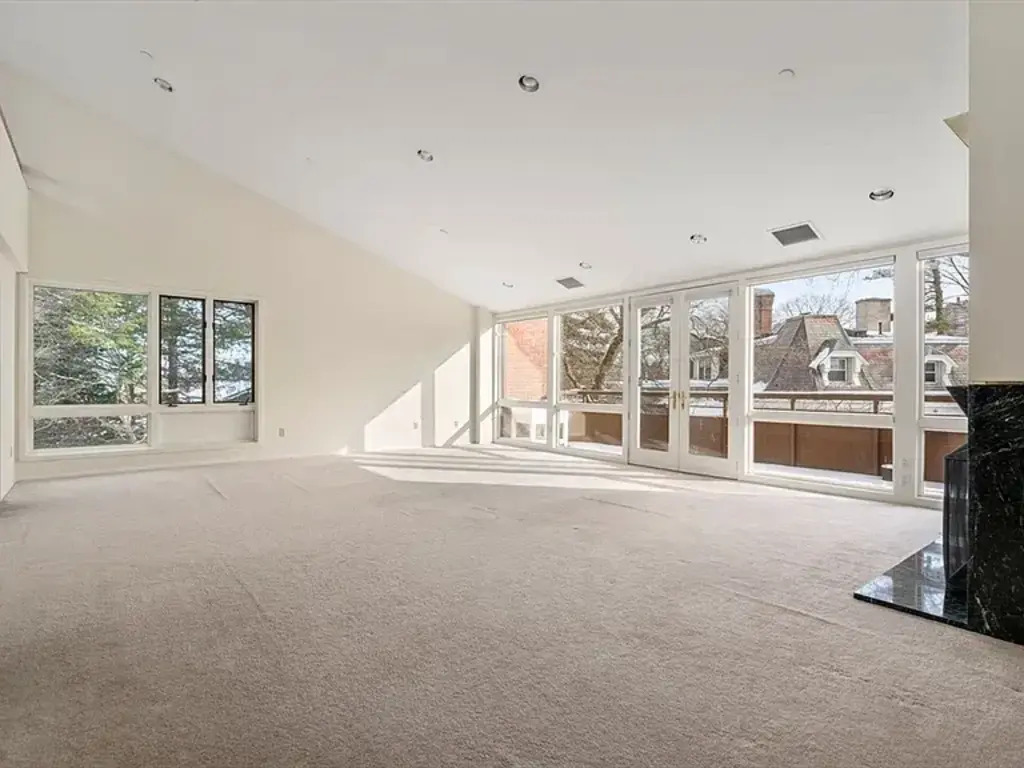 Living/Dining room with balcony overlooking "The Castle" and Jamaica Pond