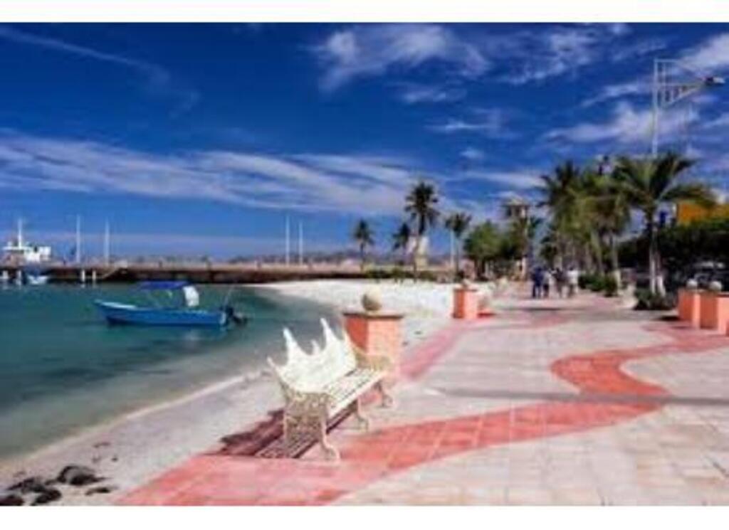 Enjoy a walk and watch the sunset from the malecon, beachside path.