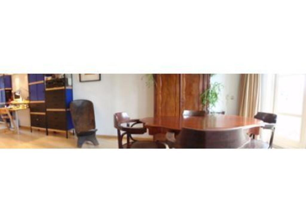 living room with dining area facing the garden 