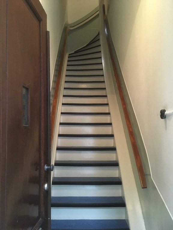The stairs behind the front door