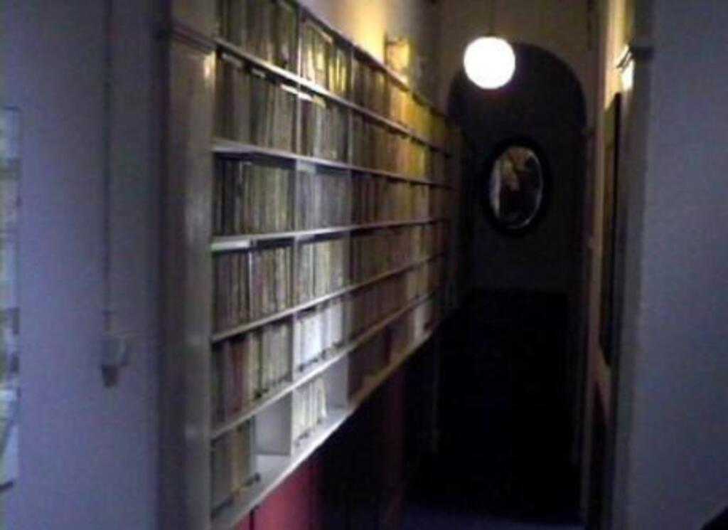 hallway lined with paperbacks