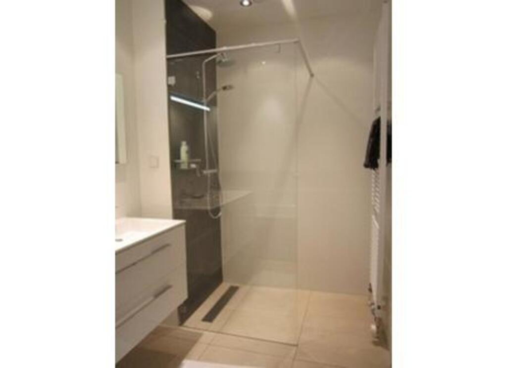 Bathroom with shower, double sink and bath