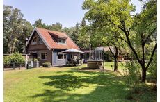 Our cozy house with hottub, sunny garden and woodland