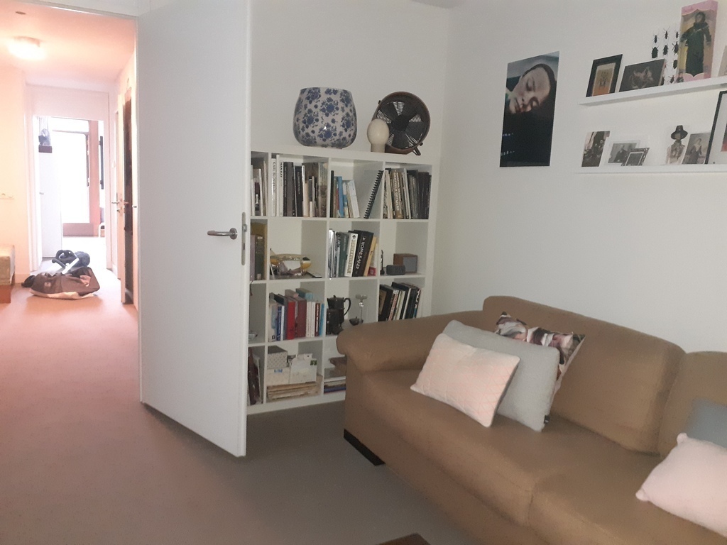 TV room on the first floor with comfortable couch