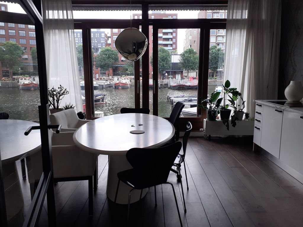 Kitchen/living area with view over the Westerdok and harbor