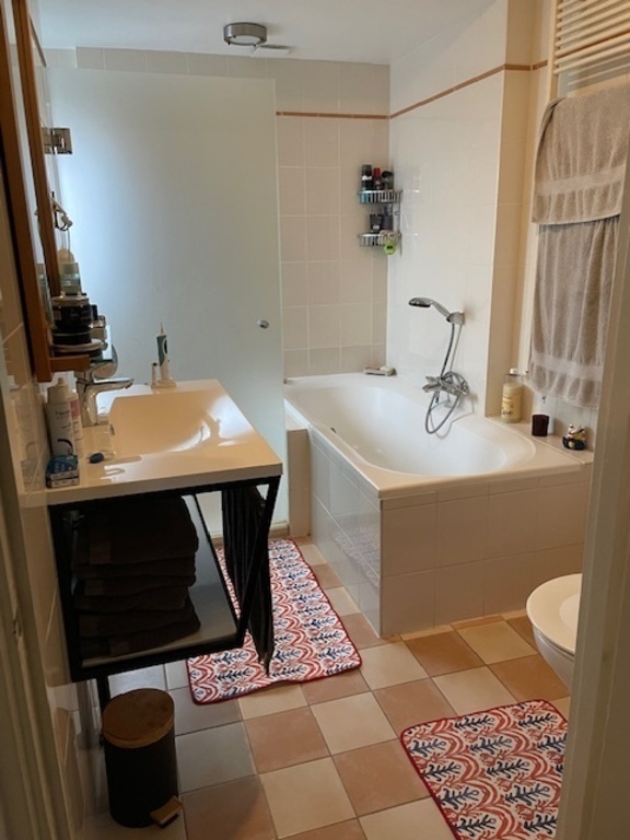 Bathroom with bath and shower