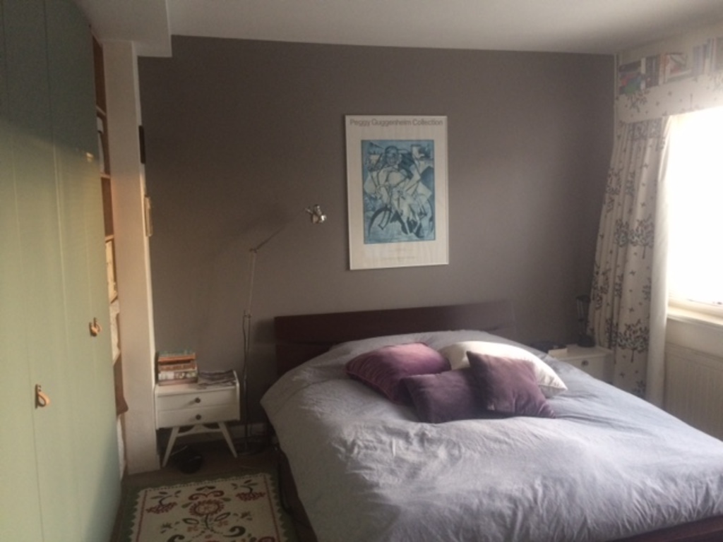 Bedroom with double bed and balcony