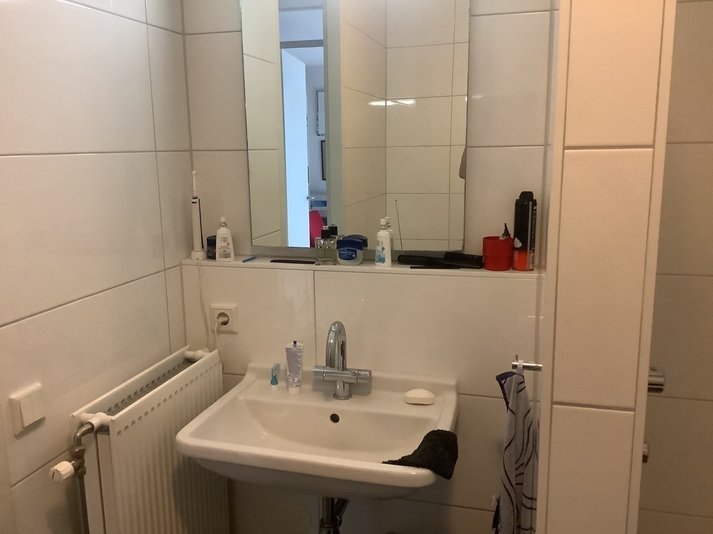 Washtable and mirror in bathroom