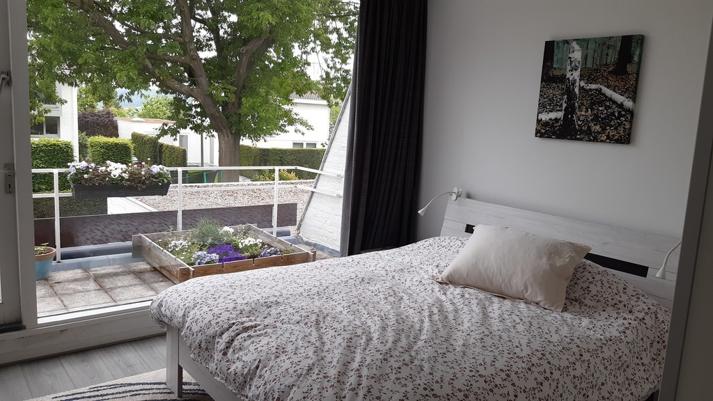 Master bedroom with balcony on 1st floor