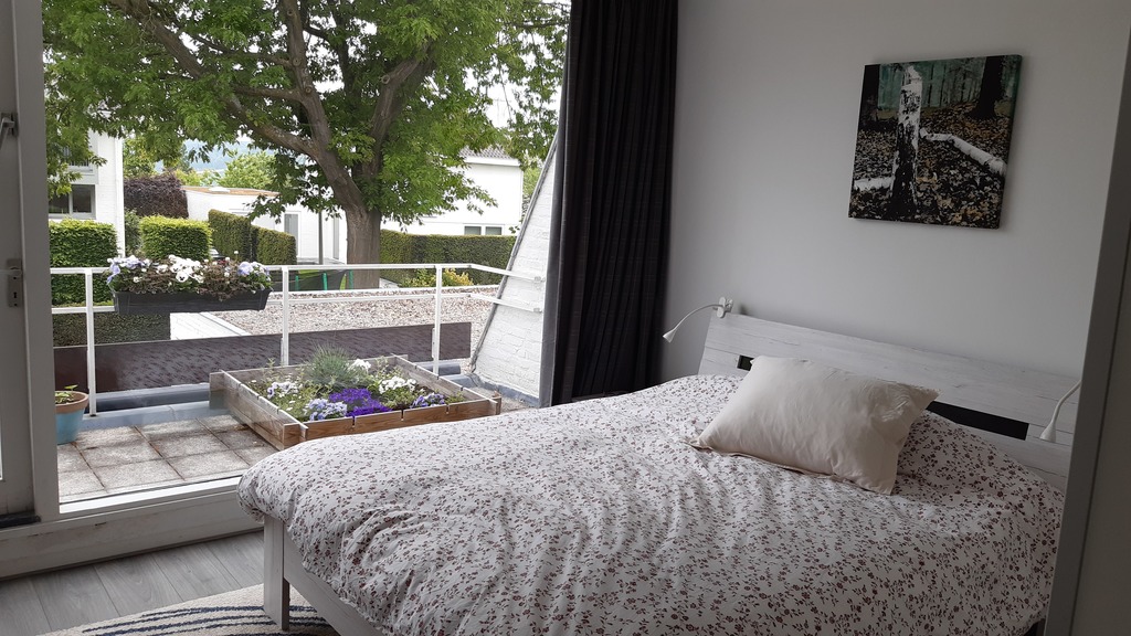 Master bedroom with balcony on 1st floor