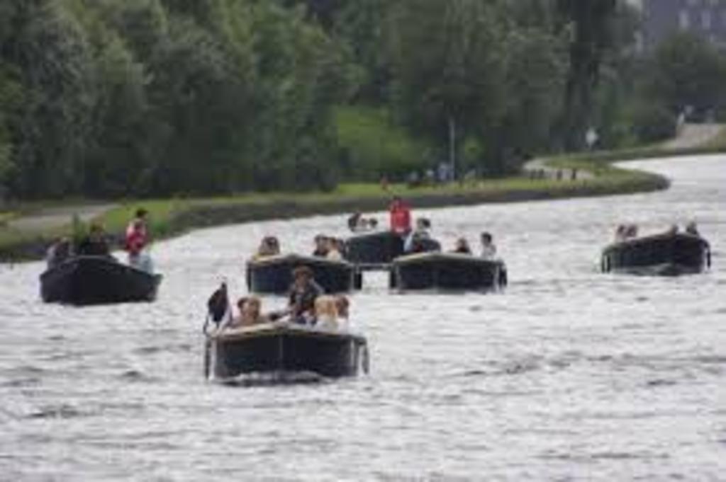 de Vliet; at the end of our street; rent a popular 'sloepje' (boat as pictured) at the Vlietlanden and become a real Dutchy.