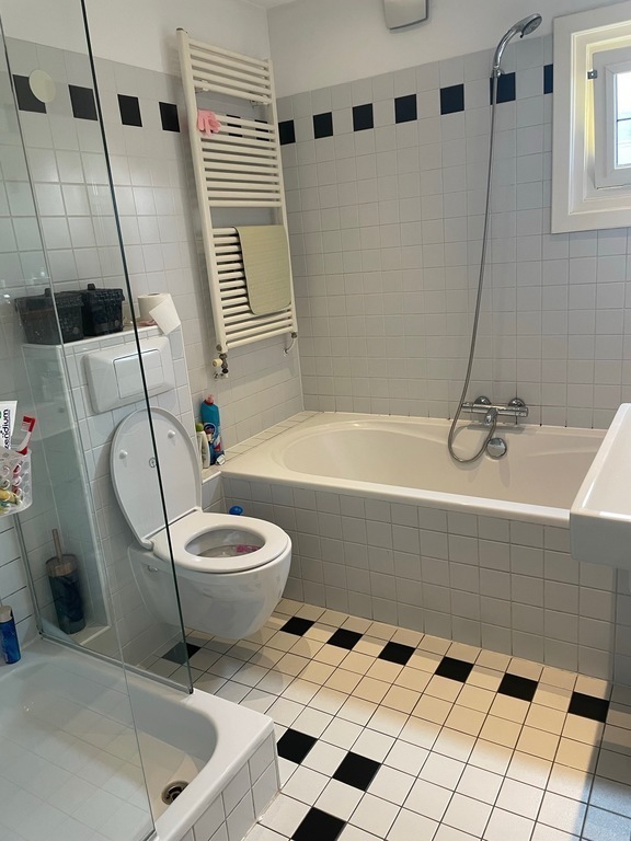 First bathroom with shower & bath