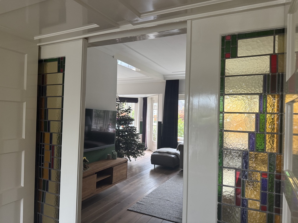 Living room has authentic sliding doors between living and dining area