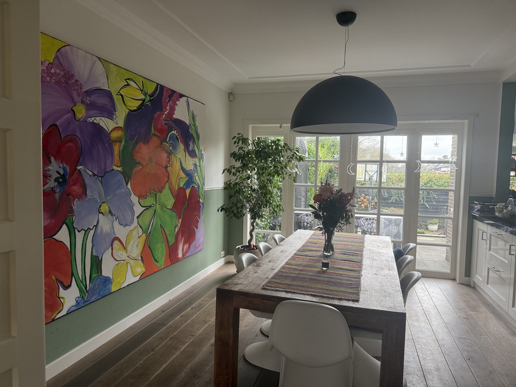 Dining area with table for 8 and opening doors to the terrace