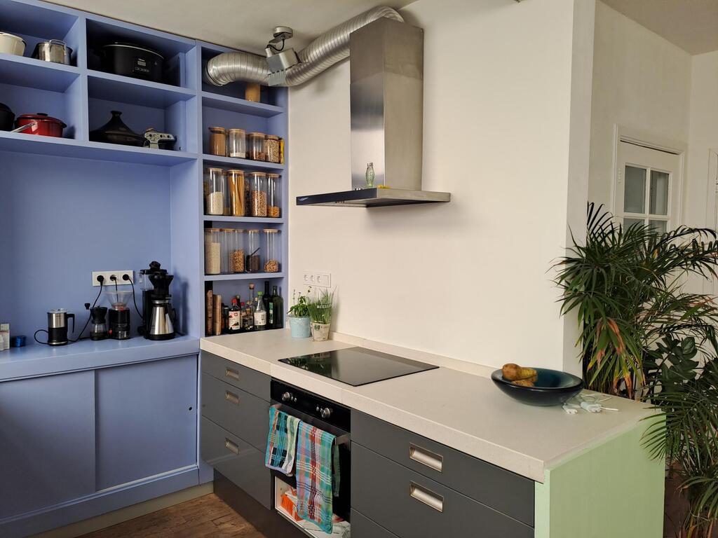 Next to the dining room, conveniently close, is an open kitchen