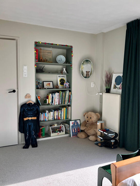 Kids room with lots of books and toys