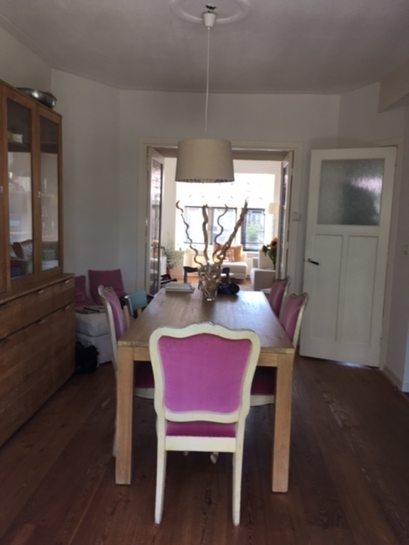 Dining room facing open kitchen.
