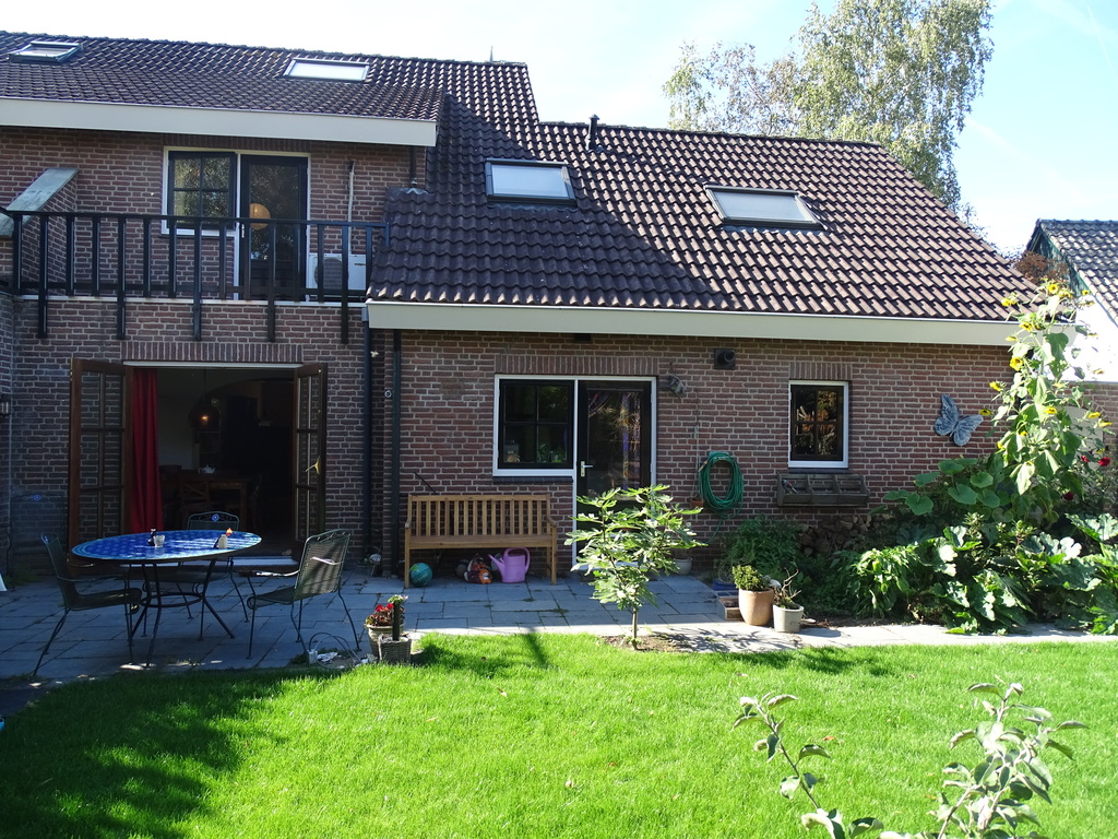 Garden and house view from the back side: balcony and air conditioning in the parents' room on the left side
