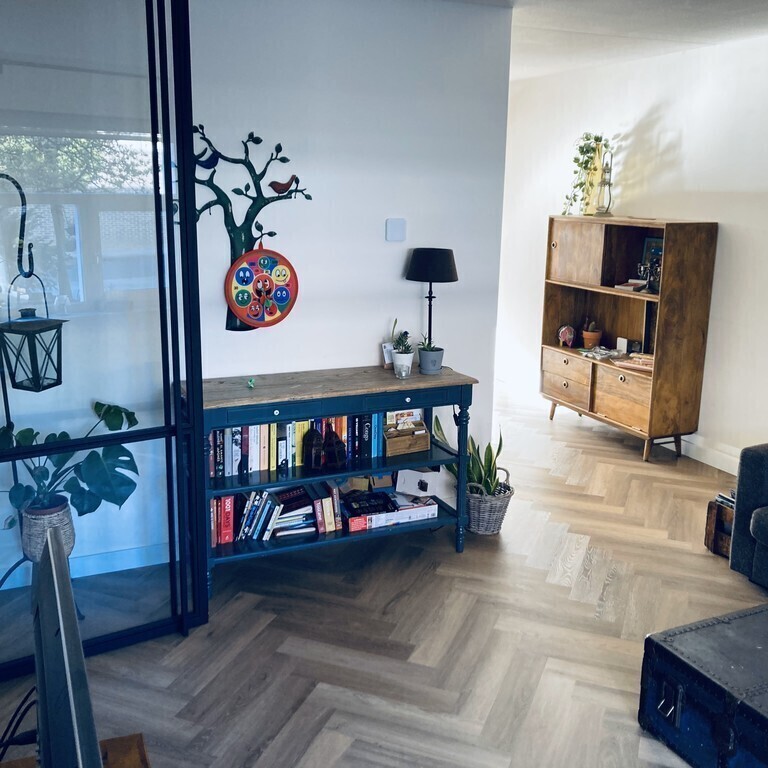 Living room with view towards dining/kitchen area