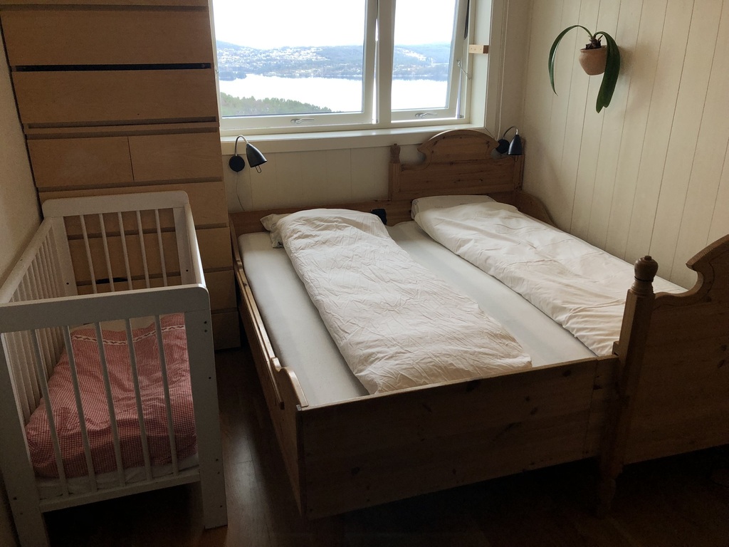 Bedroom 1 upstairs, with 180 cm bed and a baby's cot
