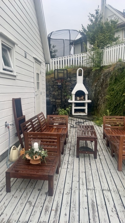 The terrace is on the south west side of the house