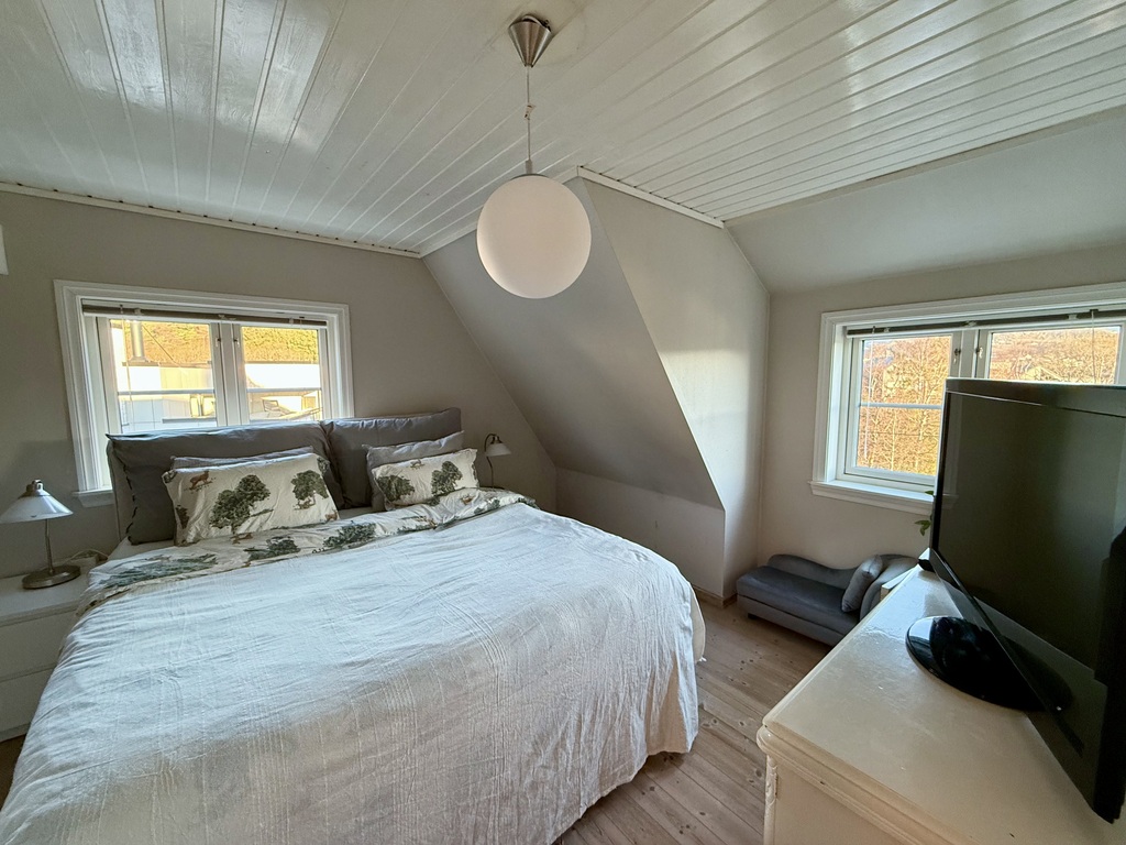 First bedroom with King sized double bed, radio, TV and blueray/cd player