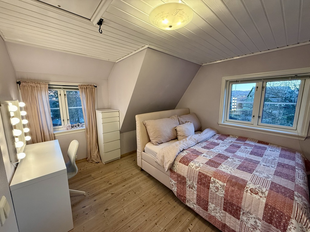 The second bedroom has a double bed and a make up table