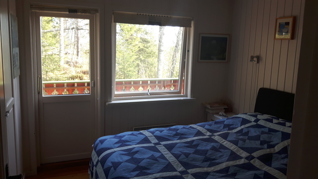 main bedroom with door to east facing balcony