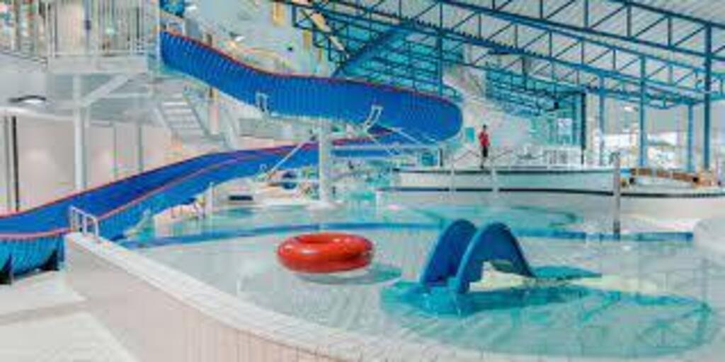 Go swimming at Badeland with numerous slides