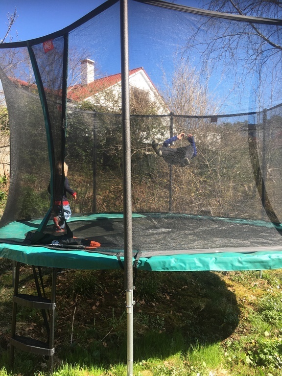 Large trampoline and sandbox in the garden. Playgrounds and football courts at short walking distances