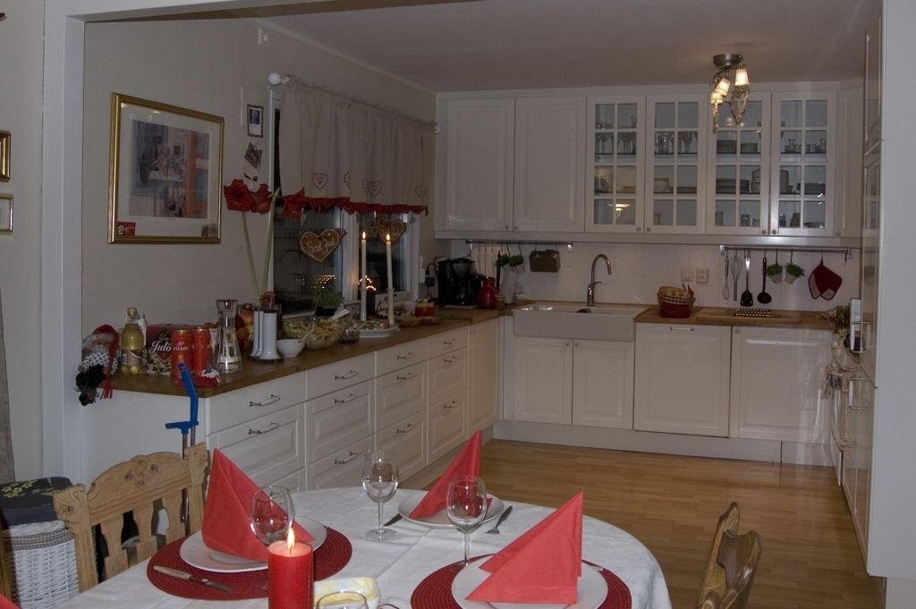 The kitchen is well equipped, right inside outdoors dining space .