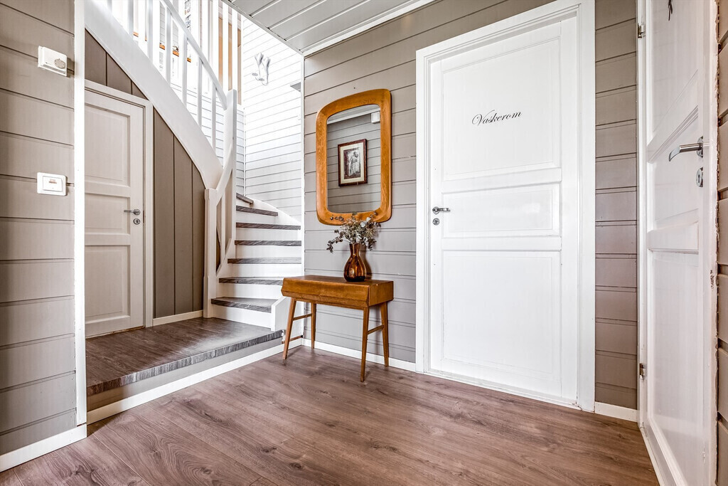 Hallway with entrance to bathroom/washing room 