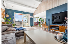 The tv-room with entrance to balcony