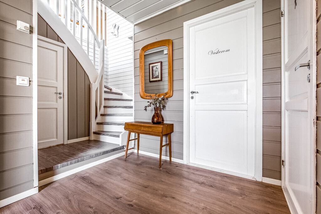 Hallway with entrance to bathroom/washing room 