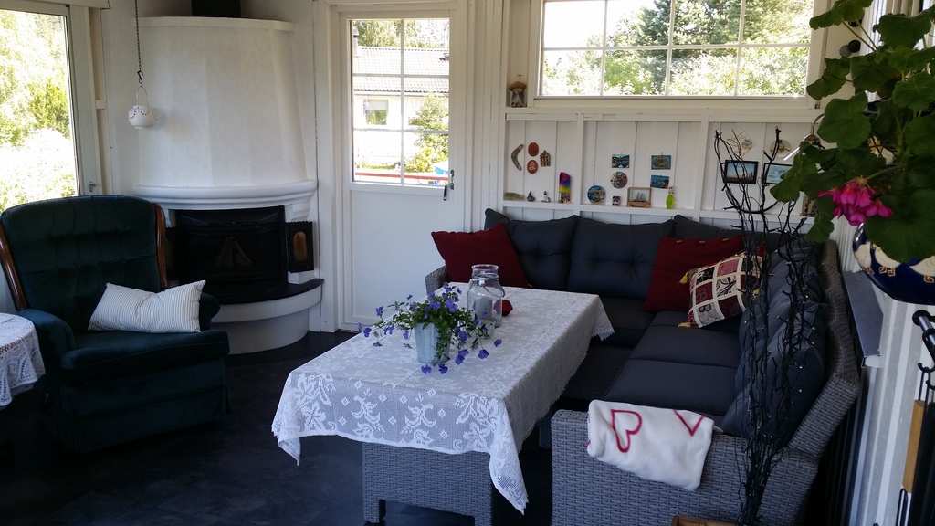 Glassed in terrace with fireplace and sliding doors and window