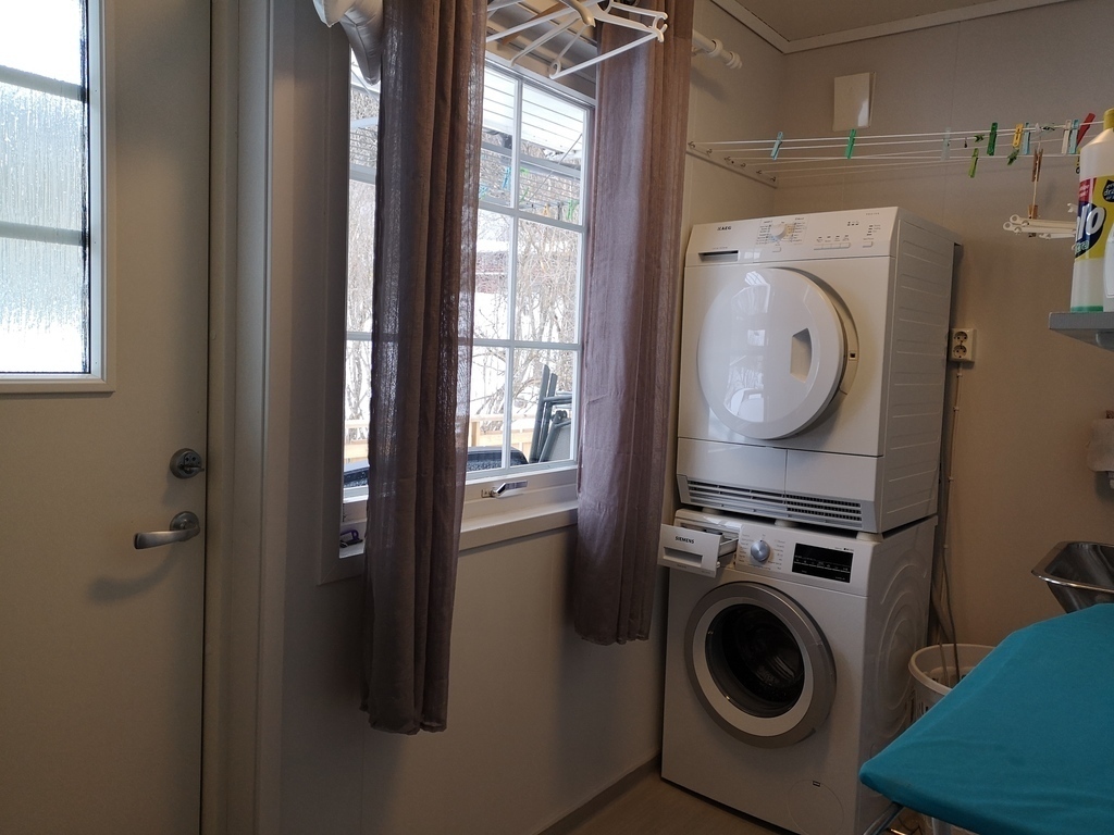 Laundryroom with exit to back garden.