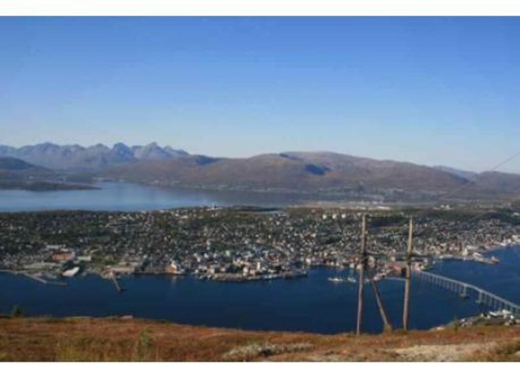Tromsø as seen from the mountains. This view is easily accessible by means of "Fjellheisen" (Cable car ride).