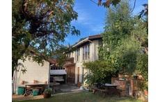 The house is in a quiet suburban area with lovely views and a private garden. 