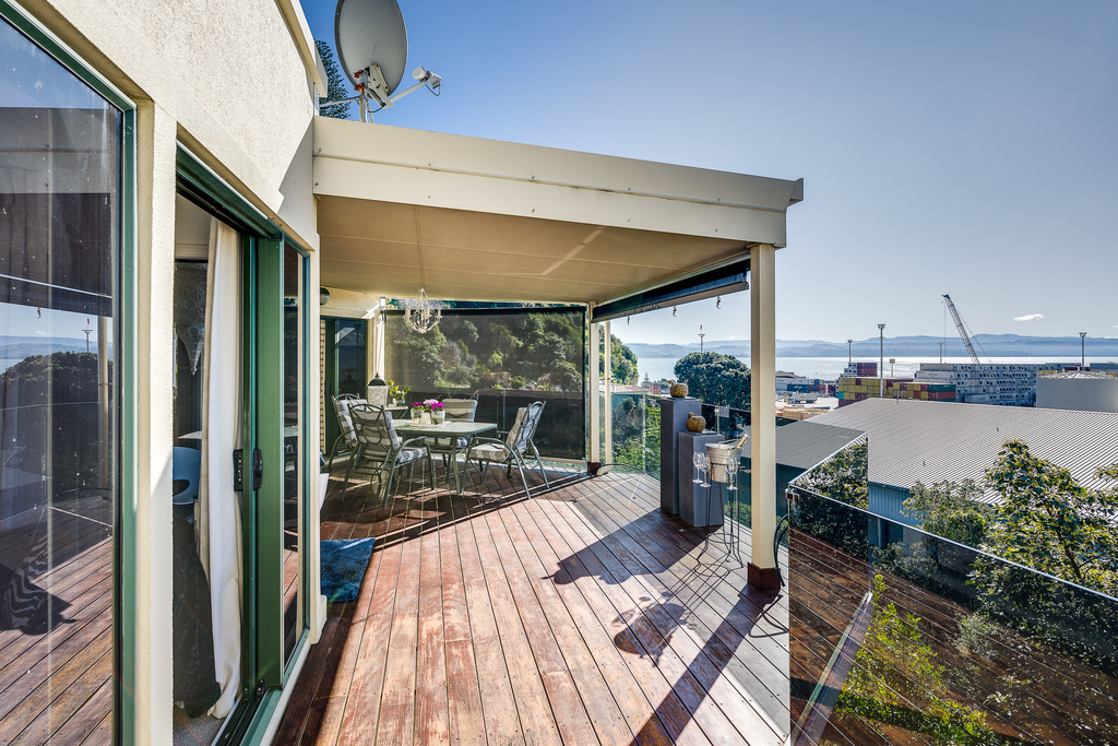 Bedroom and living opening onto sun drenched decks
