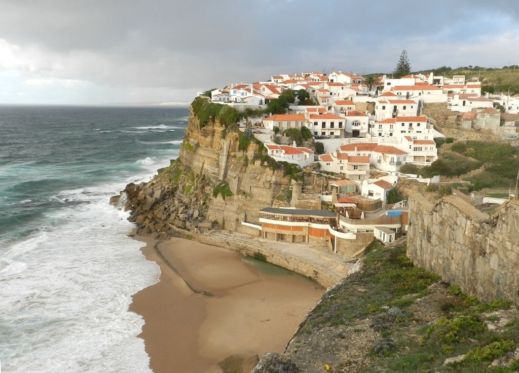Azenhas do Mar is a small coastal town to take a break on a small sandy beach with a seawater pool.